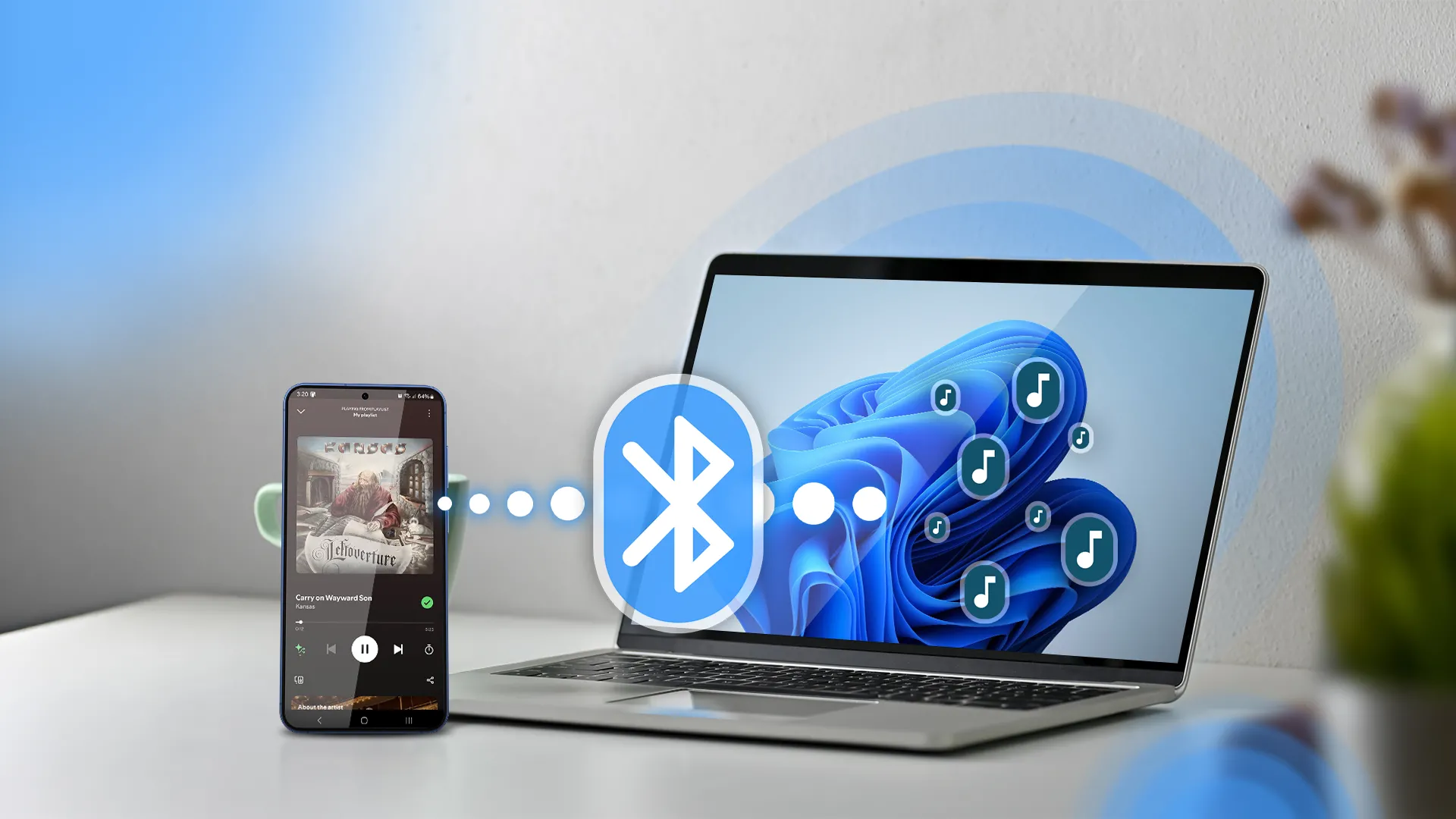 Điện thoại và laptop Windows 11 hiển thị biểu tượng Bluetooth, đang phát nhạc