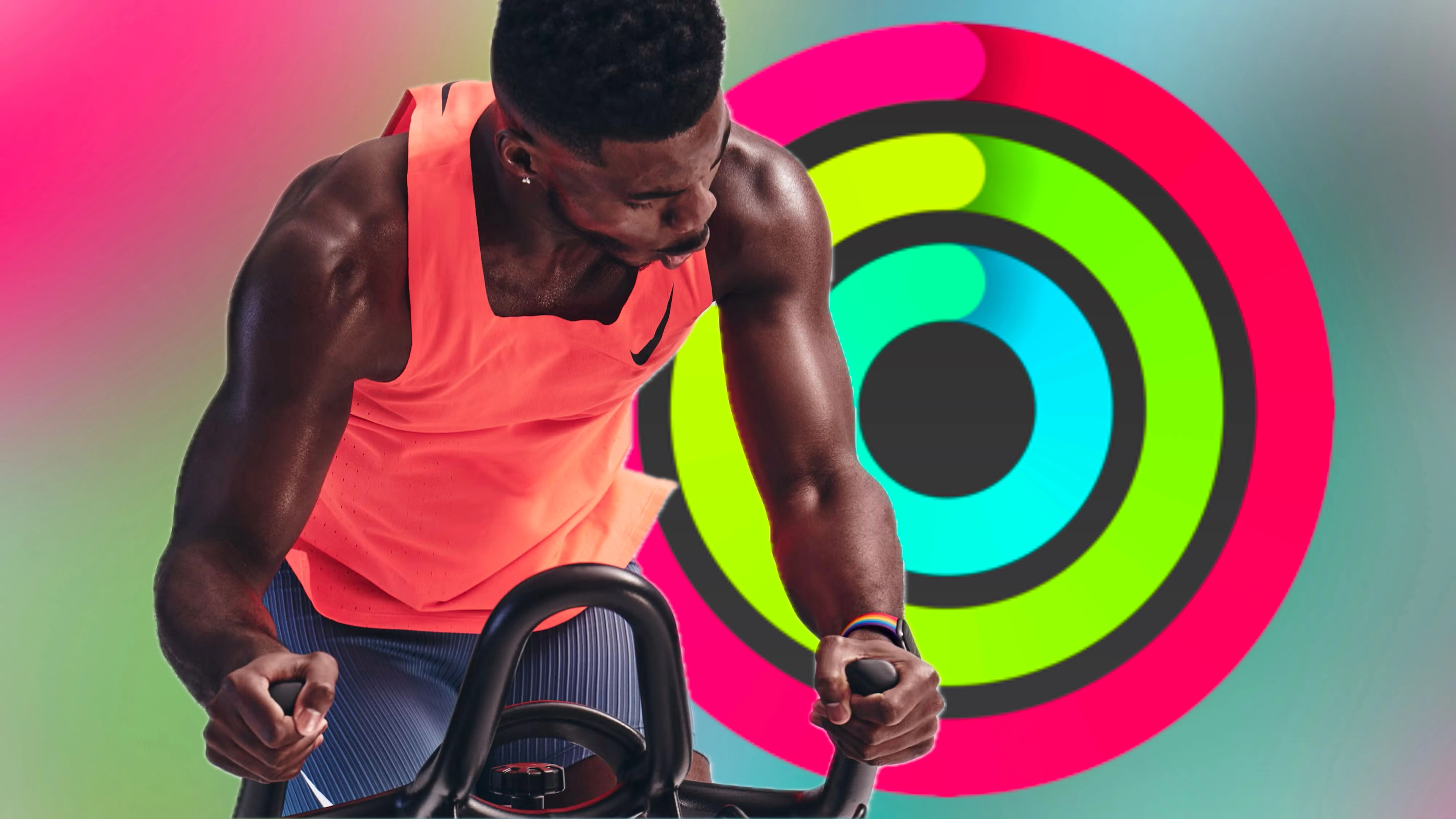 Huấn luyện viên Apple Fitness+ tập luyện với vòng Hoạt động trên nền màu sắc rực rỡ