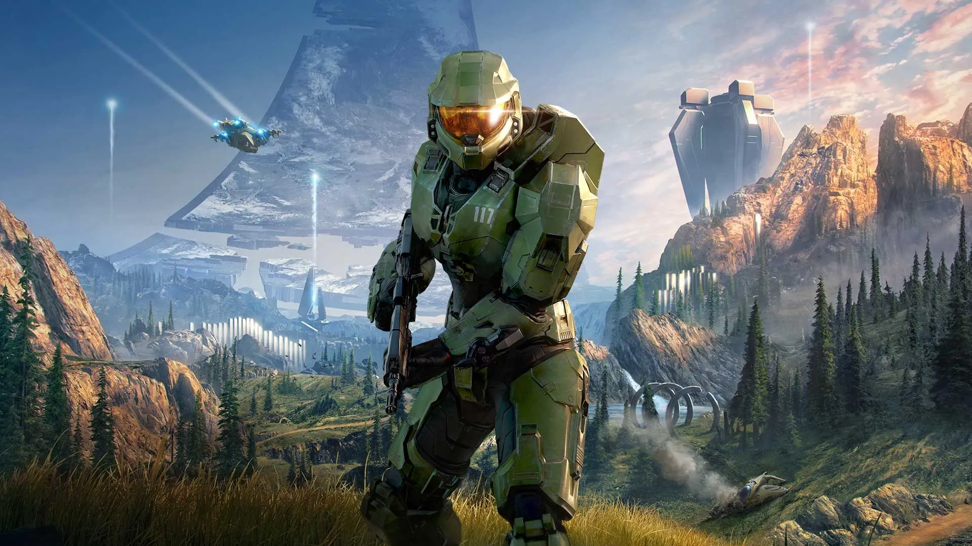 Master Chief cầm vũ khí trong khung cảnh rừng cỏ của Halo Infinite, biểu tượng một thời của game độc quyền Xbox