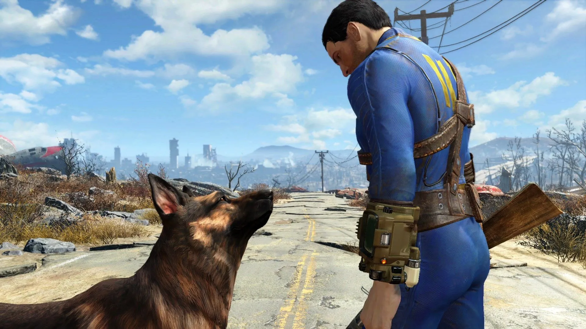 Nate nhìn xuống Dogmeat trên con đường hoang tàn trong thế giới hậu tận thế của Fallout 4